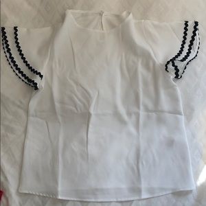White blouse with ricrac sleeves